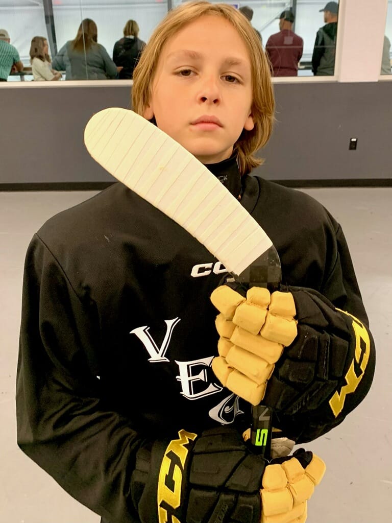 Player on the ice with a hockey stick